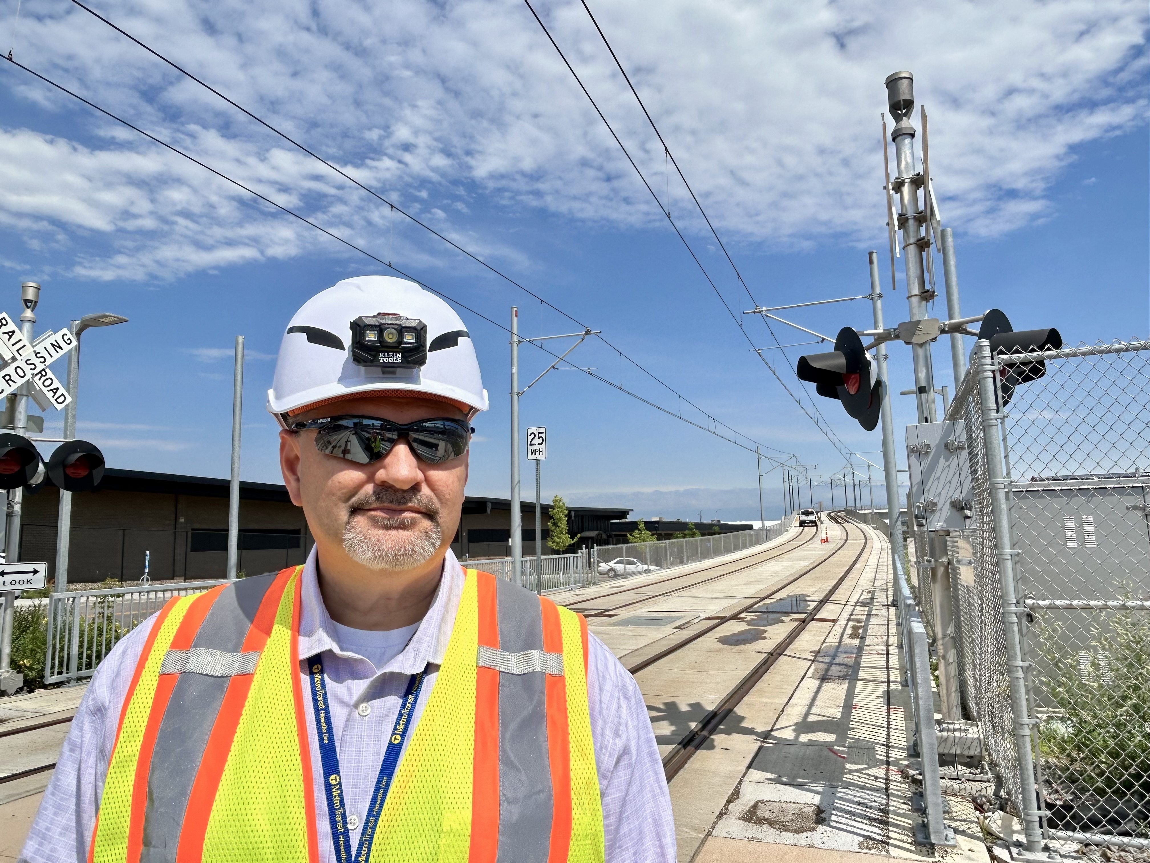 Carlos Canchola, Director, Rail Systems Maintenance, at a METRO Green Line Extension station.